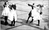 An illustration from Folk-dances and singing games; Dances of the people (1909)