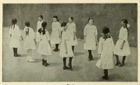 An illustration from Dances of the people : a second volume of Folk-dances and singing games; containing twenty-eight folk-dances of the United States, Ireland, England, Scotland, Norway, Sweden, Denmark, Finland, Germany, and Switzerland; with the music, full directions for performance and numerous illustrations (1913)