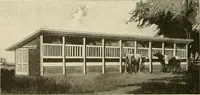 An illustration from Guaranteed building plans with interior views and details : a standard collection of new, original and artistic designs of cottages, bungalows, residences and flats of frame, brick, cement, plaster, concrete blocks, hollow tile, stucco, etc. and farm buildings of all descriptions together with interior and exterior details and interior views arranged and described by William A. Radford. (1915)