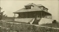 An illustration from Guaranteed building plans with interior views and details : a standard collection of new, original and artistic designs of cottages, bungalows, residences and flats of frame, brick, cement, plaster, concrete blocks, hollow tile, stucco, etc. and farm buildings of all descriptions together with interior and exterior details and interior views arranged and described by William A. Radford. (1915)