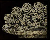 An illustration from A history of hand-made lace : Dealing with the origin of lace, the growth of the great lace centres, the mode of manufacture, the methods of distinguishing and the care of various kinds of lace ... (1900)