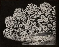 An illustration from A history of hand-made lace : dealing with the origin of lace, the growth of the great lace centres, the mode of manufacture, the methods of distinguishing and the care of various kinds of lace (1900)