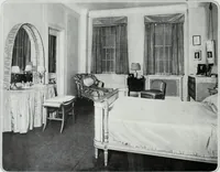 An illustration from House & garden's book of interiors, containing over three hundred illustrations of living rooms, dining rooms, libraries, halls, bedrooms, porches, breakfast rooms, nurseries, kitchens, bathrooms and the use of decorative accessories and curtains, together with practical suggestions for the furnishing and decorating of each type of room in the house (1920)