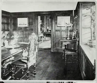 An illustration from House & garden's book of interiors, containing over three hundred illustrations of living rooms, dining rooms, libraries, halls, bedrooms, porches, breakfast rooms, nurseries, kitchens, bathrooms and the use of decorative accessories and curtains, together with practical suggestions for the furnishing and decorating of each type of room in the house (1920)
