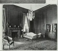 An illustration from House & garden's book of interiors, containing over three hundred illustrations of living rooms, dining rooms, libraries, halls, bedrooms, porches, breakfast rooms, nurseries, kitchens, bathrooms and the use of decorative accessories and curtains, together with practical suggestions for the furnishing and decorating of each type of room in the house (1920)