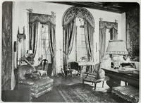 An illustration from House & garden's book of interiors, containing over three hundred illustrations of living rooms, dining rooms, libraries, halls, bedrooms, porches, breakfast rooms, nurseries, kitchens, bathrooms and the use of decorative accessories and curtains, together with practical suggestions for the furnishing and decorating of each type of room in the house (1920)