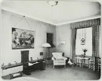 An illustration from House & garden's book of interiors, containing over three hundred illustrations of living rooms, dining rooms, libraries, halls, bedrooms, porches, breakfast rooms, nurseries, kitchens, bathrooms and the use of decorative accessories and curtains, together with practical suggestions for the furnishing and decorating of each type of room in the house (1920)