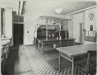 An illustration from House & garden's book of interiors, containing over three hundred illustrations of living rooms, dining rooms, libraries, halls, bedrooms, porches, breakfast rooms, nurseries, kitchens, bathrooms and the use of decorative accessories and curtains, together with practical suggestions for the furnishing and decorating of each type of room in the house (1920)