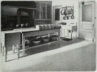 An illustration from House & garden's book of interiors, containing over three hundred illustrations of living rooms, dining rooms, libraries, halls, bedrooms, porches, breakfast rooms, nurseries, kitchens, bathrooms and the use of decorative accessories and curtains, together with practical suggestions for the furnishing and decorating of each type of room in the house (1920)