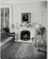 An illustration from House & garden's book of interiors, containing over three hundred illustrations of living rooms, dining rooms, libraries, halls, bedrooms, porches, breakfast rooms, nurseries, kitchens, bathrooms and the use of decorative accessories and curtains, together with practical suggestions for the furnishing and decorating of each type of room in the house (1920)