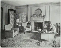 An illustration from House & garden's book of interiors, containing over three hundred illustrations of living rooms, dining rooms, libraries, halls, bedrooms, porches, breakfast rooms, nurseries, kitchens, bathrooms and the use of decorative accessories and curtains, together with practical suggestions for the furnishing and decorating of each type of room in the house (1920)