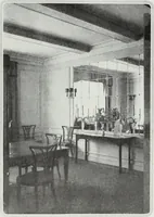 An illustration from House & garden's book of interiors, containing over three hundred illustrations of living rooms, dining rooms, libraries, halls, bedrooms, porches, breakfast rooms, nurseries, kitchens, bathrooms and the use of decorative accessories and curtains, together with practical suggestions for the furnishing and decorating of each type of room in the house (1920)