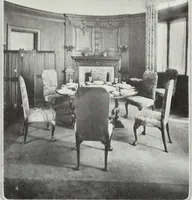 An illustration from House & garden's book of interiors, containing over three hundred illustrations of living rooms, dining rooms, libraries, halls, bedrooms, porches, breakfast rooms, nurseries, kitchens, bathrooms and the use of decorative accessories and curtains, together with practical suggestions for the furnishing and decorating of each type of room in the house (1920)