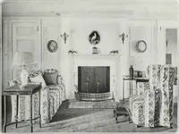 An illustration from House & garden's book of interiors, containing over three hundred illustrations of living rooms, dining rooms, libraries, halls, bedrooms, porches, breakfast rooms, nurseries, kitchens, bathrooms and the use of decorative accessories and curtains, together with practical suggestions for the furnishing and decorating of each type of room in the house (1920)