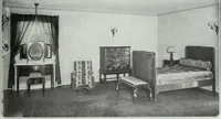 An illustration from House & garden's book of interiors, containing over three hundred illustrations of living rooms, dining rooms, libraries, halls, bedrooms, porches, breakfast rooms, nurseries, kitchens, bathrooms and the use of decorative accessories and curtains, together with practical suggestions for the furnishing and decorating of each type of room in the house (1920)