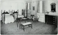 An illustration from House & garden's book of interiors, containing over three hundred illustrations of living rooms, dining rooms, libraries, halls, bedrooms, porches, breakfast rooms, nurseries, kitchens, bathrooms and the use of decorative accessories and curtains, together with practical suggestions for the furnishing and decorating of each type of room in the house (1920)