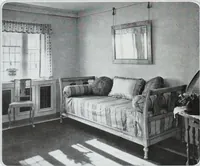 An illustration from House & garden's book of interiors, containing over three hundred illustrations of living rooms, dining rooms, libraries, halls, bedrooms, porches, breakfast rooms, nurseries, kitchens, bathrooms and the use of decorative accessories and curtains, together with practical suggestions for the furnishing and decorating of each type of room in the house (1920)
