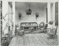 An illustration from House & garden's book of interiors, containing over three hundred illustrations of living rooms, dining rooms, libraries, halls, bedrooms, porches, breakfast rooms, nurseries, kitchens, bathrooms and the use of decorative accessories and curtains, together with practical suggestions for the furnishing and decorating of each type of room in the house (1920)