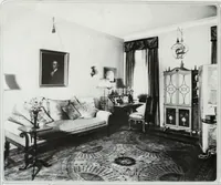 An illustration from House & garden's book of interiors, containing over three hundred illustrations of living rooms, dining rooms, libraries, halls, bedrooms, porches, breakfast rooms, nurseries, kitchens, bathrooms and the use of decorative accessories and curtains, together with practical suggestions for the furnishing and decorating of each type of room in the house (1920)