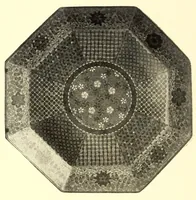 An illustration from Illustrated Catalogue of the Noteworthy Collection of Cloisonne and Other Enamels, Old Japanese Bronzes, Sword Guards, Knife Handles, Swords, Lacquers and Fine Old Brocades : belonging to Dr. Alfred Owre of Minneapolis (1917)