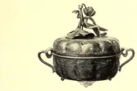 An illustration from Illustrated Catalogue of the Noteworthy Collection of Cloisonne and Other Enamels, Old Japanese Bronzes, Sword Guards, Knife Handles, Swords, Lacquers and Fine Old Brocades : belonging to Dr. Alfred Owre of Minneapolis (1917)