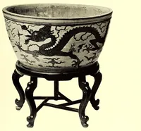An illustration from Illustrated Catalogue of a Very Important Collection of Antique Chinese Porcelains including Fine Specimens of Sang-De-Bceuf and Peachbloom Tang and Ming Pottery, Carved Jade and Other Hard Stones, Cloisonne Enamels, a Number of Ming Large Plant Jars and Antique Chinese Rugs : collected by Messrs. Voron & Chiat of New York (1918)