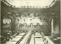 An illustration from L'art à la Taverne de Paris. Chéret, Abel Faivre, Grün, Léandre, Métivet, Steinlen, Willette, artistes peintres. Emile Robert, ferronnier d'art. Jacques Hermant, architecte. Photogravures de Ducourtioux et Huillard, d'après les clichés de Simonet (1906)