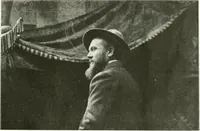 An illustration from L'art à la Taverne de Paris. Chéret, Abel Faivre, Grün, Léandre, Métivet, Steinlen, Willette, artistes peintres. Emile Robert, ferronnier d'art. Jacques Hermant, architecte. Photogravures de Ducourtioux et Huillard, d'après les clichés de Simonet (1906)