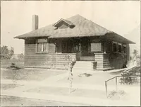 An illustration from The plan book of American dwellings : being a compilation of original home designs, showing actual photographic exteriors and floor plans of moderately priced bungalows, cottages, residences (1914)