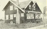 An illustration from The plan book of American dwellings : being a compilation of original home designs, showing actual photographic exteriors and floor plans of moderately priced bungalows, cottages, residences (1914)