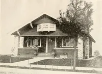 An illustration from The plan book of American dwellings : being a compilation of original home designs, showing actual photographic exteriors and floor plans of moderately priced bungalows, cottages, residences (1914)