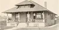 An illustration from The plan book of American dwellings : being a compilation of original home designs, showing actual photographic exteriors and floor plans of moderately priced bungalows, cottages, residences (1914)