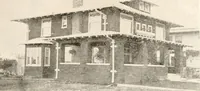 An illustration from The plan book of American dwellings : being a compilation of original home designs, showing actual photographic exteriors and floor plans of moderately priced bungalows, cottages, residences (1914)