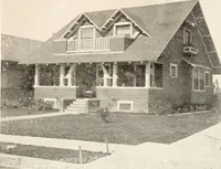 An illustration from The plan book of American dwellings : being a compilation of original home designs, showing actual photographic exteriors and floor plans of moderately priced bungalows, cottages, residences (1914)