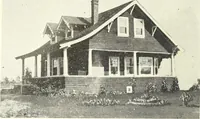 An illustration from The plan book of American dwellings : being a compilation of original home designs, showing actual photographic exteriors and floor plans of moderately priced bungalows, cottages, residences (1914)