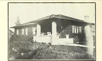 An illustration from The plan book of American dwellings : being a compilation of original home designs, showing actual photographic exteriors and floor plans of moderately priced bungalows, cottages, residences (1914)