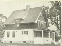 An illustration from The plan book of American dwellings : being a compilation of original home designs, showing actual photographic exteriors and floor plans of moderately priced bungalows, cottages, residences (1914)