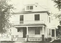 An illustration from The plan book of American dwellings : being a compilation of original home designs, showing actual photographic exteriors and floor plans of moderately priced bungalows, cottages, residences (1914)