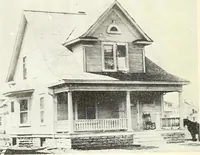 An illustration from The plan book of American dwellings : being a compilation of original home designs, showing actual photographic exteriors and floor plans of moderately priced bungalows, cottages, residences (1914)
