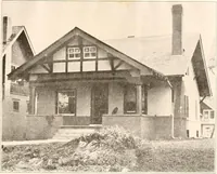An illustration from The plan book of American dwellings : being a compilation of original home designs, showing actual photographic exteriors and floor plans of moderately priced bungalows, cottages, residences (1914)