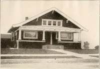 An illustration from The plan book of American dwellings : being a compilation of original home designs, showing actual photographic exteriors and floor plans of moderately priced bungalows, cottages, residences (1914)