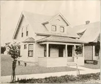 An illustration from The plan book of American dwellings : being a compilation of original home designs, showing actual photographic exteriors and floor plans of moderately priced bungalows, cottages, residences (1914)