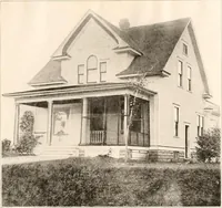 An illustration from The plan book of American dwellings : being a compilation of original home designs, showing actual photographic exteriors and floor plans of moderately priced bungalows, cottages, residences (1914)