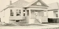 An illustration from The plan book of American dwellings : being a compilation of original home designs, showing actual photographic exteriors and floor plans of moderately priced bungalows, cottages, residences (1914)