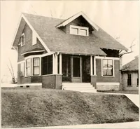 An illustration from The plan book of American dwellings : being a compilation of original home designs, showing actual photographic exteriors and floor plans of moderately priced bungalows, cottages, residences (1914)