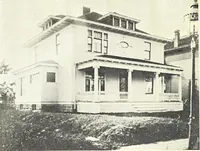 An illustration from The plan book of American dwellings : being a compilation of original home designs, showing actual photographic exteriors and floor plans of moderately priced bungalows, cottages, residences (1914)