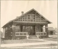 An illustration from The plan book of American dwellings : being a compilation of original home designs, showing actual photographic exteriors and floor plans of moderately priced bungalows, cottages, residences (1914)