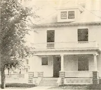 An illustration from The plan book of American dwellings : being a compilation of original home designs, showing actual photographic exteriors and floor plans of moderately priced bungalows, cottages, residences (1914)