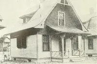 An illustration from The plan book of American dwellings : being a compilation of original home designs, showing actual photographic exteriors and floor plans of moderately priced bungalows, cottages, residences (1914)