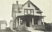 An illustration from The plan book of American dwellings : being a compilation of original home designs, showing actual photographic exteriors and floor plans of moderately priced bungalows, cottages, residences (1914)